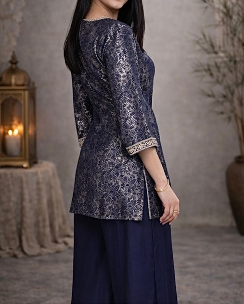 Elegant navy blue jacquard suit featuring intricate woven pattern with a refined contrast border , tailored in a flattering silhouette