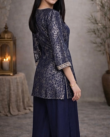 Elegant navy blue jacquard suit featuring intricate woven pattern with a refined contrast border , tailored in a flattering silhouette